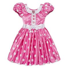 a pink dress with white polka dots on it