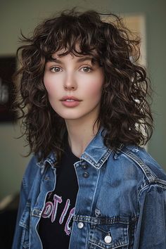 A curly shag haircut with full bangs, exuding a playful retro vibe. Thick Curly Bangs, Shag Haircut Wavy Thick Hair, Curly Lob Bangs, Shaggy Curly Haircut, Curling Shag Haircut, Curly Shag Without Bangs, Shaggy Curly Hair Without Bangs, Shag Thick Wavy Hair