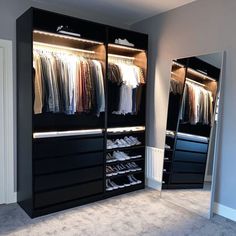 a walk in closet filled with lots of clothes