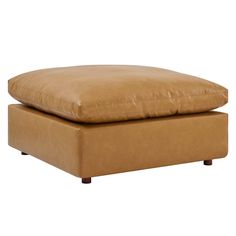 a tan leather footstool with a square cushion on the bottom and wooden legs