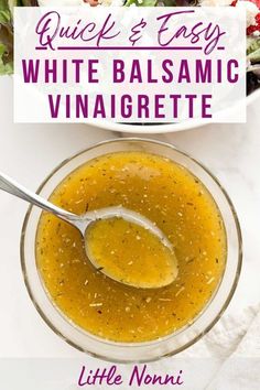 a bowl of white balsamic vinaigrete with a spoon in it