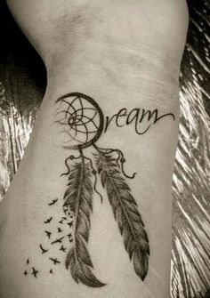 a tattoo with the word dream written on it