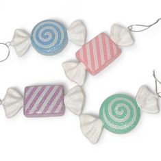 four candy candies with different designs on them