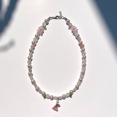 Pink, floral-themed beaded necklace! Designed with shiny, glass beads and pink quartz. Adorned with leaves and flower charms <3 Pretty L, Necklace Aesthetic, Pink Jewelry, Floral Necklace, Quartz Rose, Pink Quartz, Flower Charm, Pink Floral, Charm Necklace