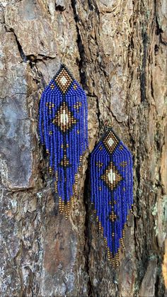 Complete your Bohemian chic outfit with these gorgeous indigo shoulder dusters and bring out your inner boho. Intricately handwoven with high quality Japanese glass beads and Japanese nylon thread for extra durability. Gorgeous colors Indigo blue, matte black, browns and golds.  *Hypoallergenic ear hooks, nickel and lead free and come with silicone backs to secure them. Please note that due to their handmade nature , each earring may differ slightly from the other. **Please care for your jewelry as you would with any valued piece of jewelry. To keep the materials in good condition, do not wear while swimming, bathing or heavily exercising.  Store your jewelry lying flat or hanging from a jewelry hanger. These earrings are "made to order". Please allow 1 to 3 business days processing time, Blue Fringed Beaded Earrings For Festival, Bohemian Blue Beaded Earrings For Beach, Blue Beaded Fringe Earrings For Festival, Blue Bohemian Beaded Fringe Earrings, Bohemian Blue Beaded Fringe Earrings, Adjustable Blue Bohemian Beaded Earrings, Bohemian Beaded Fringe Earrings, Bohemian Woven Beaded Earrings For Beach, Artisan Handwoven Beaded Earrings For Festival