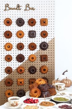 a table topped with lots of pastries and desserts