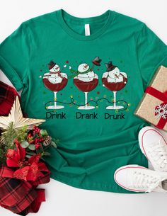 Funny Holiday Party Shirt Customized Christmas Party Shirt Custom Holiday Party Shirt Holiday Season Drinking Shirt Funny Matching Shirts  A fun and trendy Christmas shirt we know will be enjoyed! Choose from different colors depending on your preference! Holiday Party T-shirt With Short Sleeves, Holiday Party T-shirt With Crew Neck, Fitted Green Top For The Holiday Season, Fitted Green Top For Holiday, Fitted Short Sleeve Tops For Holidays, Holiday Festive Long Sleeve Shirt, Festive Winter Short Sleeve Shirt, Festive Short Sleeve Winter Shirt, Fitted Short Sleeve Christmas Top