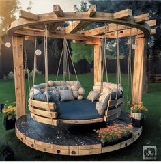 an outdoor swing bed with pillows on it