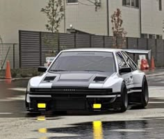 an image of a car that is driving in the rain