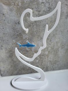 **Blue Resin Shark Earrings: Dive into Elegance** Take a plunge into oceanic style with these stunning shark earrings, handcrafted with mesmerizing blue resin. Each earring features a beautifully detailed shark design, capturing the majesty of marine life. Perfect for ocean lovers and trendsetters alike, these lightweight earrings offer comfort and a splash of adventure to any outfit. Whether you're gifting them or treating yourself, these shark earrings are a must-have accessory to showcase you Beach Earrings Summer, Shark Design, Shark Earrings, Earrings Beach, Beach Earrings, Earrings Summer, Summer Earrings, Animal Earrings, Summer Earring