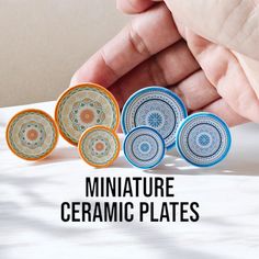 four miniature ceramic plates are shown in front of a person's hand and the words miniature ceramic plates