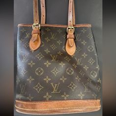 Louis Vuitton Monogram Petit Bucket M42238. I Have The Serial Tag That Came With It. It Was Purchased Early 2000s. Exactly As Pictured. It Is Still In Pretty Decent Condition. The Inside Leather Is A Little Worn On The Top Sides But Not Sticky. The Bottom Of The Bucket Is Stained. Does Not Come With The Accessory Pouch. I Tried To Picture The Details As Much As Possible But Feel Free To Ask Questions Or Request More Pics If Needed. This One Was Made In The Usa. Height 10 Inches Oval Base Is 9 X Small Buckets, Accessory Pouch, Early 2000s, I Tried, Louis Vuitton Monogram, Louis Vuitton Bag, 6 Inches, Stain, Bag Lady