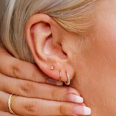 ---------------------------------------------------- Set of 3 - pave set hoop, plain hoop & 3 mm stud set. Small huggie hoop earrings plain & with Heart & Arrow CZ Stones. Super cute and wearable every day of the week, it's hard not to fall in love with these huggie earrings, you can wear these babies all day, every day! Perfect layered hoop with our plain hoops & Studs. 925 Sterling Silver earrings - with 18K Gold or Rhodium plating - Select your favorite styles : ) DETAILS:  NAME - Britney * Solid Sterling Silver * Sparking Cubic zirconia * Click in closure for pierced ears only * Minimalist hoops (Please check size & piercing location to make sure they fit)  * Sold single (1 piece) or as a pair (2 Pieces);  * Earrings inner diameter : Pave & Plain hoops - 5 6, 7, 8, 9 mm; Gauge 0.6 mm / Tragus Hoop, Earrings Cartilage, 3 Earrings, Helix Hoop, Hoop Earrings Silver, Cartilage Hoop, Hoop Earring Sets, Stud Set, Pave Ring