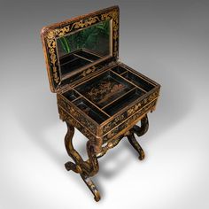 an ornate wooden table with a mirror on top