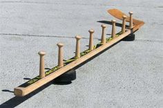 a skateboard is sitting on top of some poles