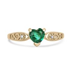 Celebrate love and elegance with this charming emerald and diamond three-stone ring. A petite heart-cut emerald takes center stage, radiating a remarkable vivid dark green hue, semi-transparent clarity, and captivating luster, set securely in a 3-prong basket. Delicate brilliant round-cut diamonds accent the sides, adding a touch of sparkle to this enchanting piece crafted in 14k yellow gold, making it an ideal choice for stacking or a heartfelt and affordable gift for a special someone. Setting Emerald Heart-shaped Anniversary Rings, Emerald Heart Shaped Anniversary Rings, Elegant Heart Shaped Emerald Ring For May Birthstone, Elegant Heart-shaped Emerald Ring For May Birthstone, Heart-shaped May Birthstone Ring For Anniversary, May Birthstone Ring With Diamond Accents For Anniversary, Green Heart Cut Diamond Ring For Anniversary, May Birthstone Anniversary Ring With Diamond Accents, Anniversary Birthstone Ring With Diamond Accents For May