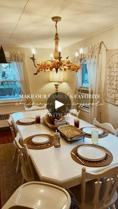 the dining room table is set with place settings