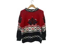 "80s Vintage Knit Wool Blend Pullover Sweater Red Gray White Canada Design Women's Small ☆ SIZE:  Women's Oversized Small (baggy) ☆ MEASUREMENTS (inches, item lying flat): ✄ Length: 24\" ✄ Width (armpit to armpit): 23.5\" ✄ Arms (armpit seam to cuff): 16.5\" ☆ COLOR:  Red, Gray, White  ☆ MATERIAL:  92% Acrylic,  8% Wool ☆ BRAND: Susann D. ☆ CONDITION: The item is vintage and previously loved.   There is no visible damage to the item.  Hand wash item. Thanks for checking out this listing! Be sure Vintage Red Sweater For Winter, Red Vintage Sweater For Winter, Vintage Red Knitted Tops, Red Vintage Knit Sweater, Vintage Red Fall Sweater, Red Vintage Knitted Sweater, Oversized Red Retro Sweater, Irish Knitwear, Oversized Flannel