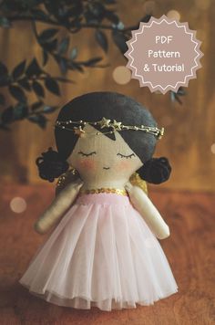 the doll is wearing a pink dress and gold chain around her neck, with text overlay that reads pdf pattern & tutor