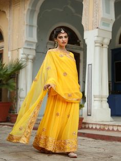 Afroz ; means illuminated and rightly the vibrant colors of this sharara set will light up your whole look for the festival. Made in breezy georgette, the set is embedded with taari and gotta work which is finished with love. Color: Yellow Fabric: Georgette Note: Length and sizes can be customised Length - Kurta 26 inches Pants 44 inches Available in other colors If you happen to see some deformity in hand-work or fabric, that’s mere the technique of the same and not a defect. The garment is qui Yellow Sharara Suits, Gulabo Jaipur, Yellow Sharara, Georgette Sharara, Sharara Pants, Kurta Sharara Set, Kurta Sharara, Traditional Attires, Gota Work