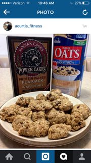 a white plate topped with cookies next to a box of oatmeal