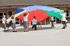 some children are playing with a kite in the middle of an open air area that reads, using evidence - based approaches in recreation program planning for children and youth