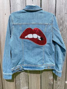 ✨👄 PICTURES DO NOT DO THIS JACKET JUSTICE 👄✨ ✨👄 This is your perfect jacket! Unique and glamorous, make a statement with your sequin lips jean jacket and instantly add some flare to any outfit 👄✨ 🖤 All women's jackets are Old Navy brand jackets, I carry sizes XS, S, M, L & XL! 🖤 Option to add spikes or rhinestones around the sequin lips! 🚨 If you would like additional customization (logos, words, phrases, etc.) please reach out to me! I have a vinyl machine with almost every color opt Red Winter Denim Jacket, Fitted Red Denim Jacket With Long Sleeves, Fitted Red Denim Jacket For Fall, Red Long Sleeve Denim Jacket For Fall, Bedazzled Jean Jacket, Denim Jacket Diy Paint, Sequin Lips, Jacket Painting, Bedazzled Jeans