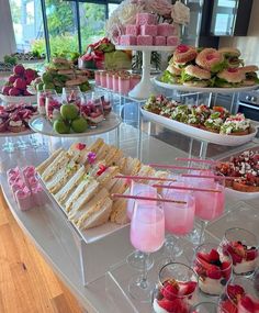 an assortment of desserts and pastries displayed on a table