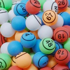 many different colored balls with numbers on them