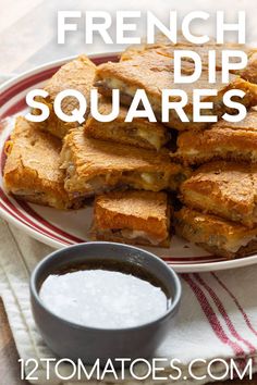 french dip squares on a plate with dipping sauce