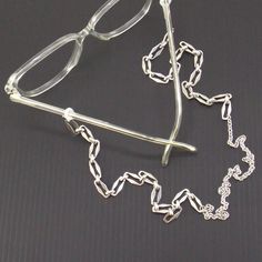 "27\" chunky (heavy) metal open rectangle link eyeglass chain with lobster clasps, for your glasses or your face mask. it comes with little rubber connectors for attaching to your glasses, and you can simply remove them if you want to use it on your mask. this chain will fit your eyeglasses, sunglasses, or your face mask! it comes in a two colors- gold and silver. measurement: 27\" long your new eyeglass/sunglass chain will come ready for gift giving, and includes an extra pair of rubber ends, t Heavy Chain Necklace, Sunglasses Holder, Gold Glasses, Chain Lanyard, Chain For Men, Mask Chain, Women Chain, Heavy Chain, Sunglass Chain