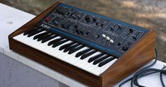 an electronic keyboard sitting on top of a table