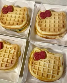 four waffles with hearts on them are in the shape of hello kitty's faces