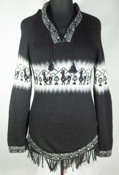 You'll adore this boho hoodie sweater with fringe, llamas and the Andes skyline outline! This is a 1990's woven wool and acrylic blend black and white pullover that's so cozy and very soft with ties and a hood. It is the real deal woven textile tunic shape garment that's made in Peru. This festival boho pullover shirt is in really great condition with hardly signs of wear/use. We couldn't find a size on the label but it seems like it's a small to medium size. To be sure about fit, please use the Bohemian Winter Tops With Fair Isle Pattern, Winter Bohemian Tops With Fair Isle Pattern, Bohemian Tops With Fair Isle Pattern For Winter, Bohemian Fair Isle Pattern Tops For Winter, Bohemian Hooded Top For Fall, Bohemian Winter Sweater For Cold Weather, Bohemian Black Hooded Hoodie, Black Bohemian Hoodie, Hippie Style Long Sleeve Winter Hoodie