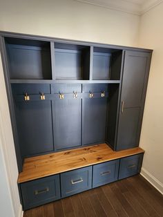 an empty room with some blue cabinets and drawers