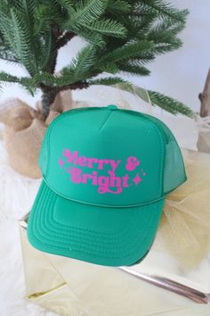 HOLIDAY COLLECTION! New Merry and Bright Trucker hat! Green hat with pink letters. This is so cute for all holiday season long! Match with your friends and family with this one! We will be living in our holiday truckers this year :) Fun Trucker Hat For Baseball Season, Baseball Season Trucker Hat, Pink Fun Trucker Hat For Beach Season, Beach Season Trucker Hat, Holiday Trucker Hats, Pink Letters, Green Hat, Pink Letter, Green Hats