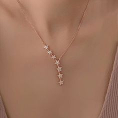 Illuminate your style with The Twinkling Stars Necklace, a celestial inspired piece crafted in Sterling Silver and plated in radiant 18K Rose Gold. Featuring seven enchanting stars, this necklace promises to make you shine wherever you go. The delicate design captures the magic of a starry night, adding a touch of celestial elegance to your every ensemble. Elevate your look and let your inner starlight shine with this captivating and timeless piece. Metal Material: Solid 925 Sterling Silver with Rose Gold Celestial Necklace, Starry Night Jewelry Necklaces, Stars Necklace, A Starry Night, Twinkling Stars, Necklace Ideas, Delicate Design, Drop Necklace, Metal Material