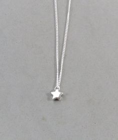 The star is silver plated and measures 9 mm It is strung on a silver plated tiny 1.3 mm curb chain with a lobster clasp closure. Choose the length from the drop down. Silver Dangle Charm Necklace With Star Charm, Silver Star Charm Necklace, Sterling Silver Star Charm Necklace Nickel Free, Nickel-free Sterling Silver Star Charm Necklace, Silver Star Necklace With Delicate Chain, Silver Star Charm Necklace With Adjustable Chain, Silver Star Charm Necklaces, Silver Necklaces With Star Charm, Dainty Silver Star Charm Necklace