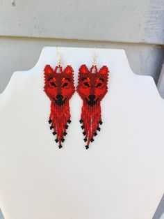 These Native Red Wolf are custom made by Elaine. They are made in  Black, Red, Orange, Delica Beads. If you have any Questions please ask.  Thanks for looking. Adjustable Red Beaded Fringe Earrings, Native American Beadwork Patterns Earrings, Handmade Red Beaded Earrings For Festival, Traditional Red Beaded Fringe Jewelry, Southwestern Red Beaded Dangling Earrings, Southwestern Red Beaded Earrings With Dangling Beads, Artisan Red Beaded Earrings With Dangling Beads, Traditional Red Beaded Earrings For Festival, Red Southwestern Style Earrings For Festivals