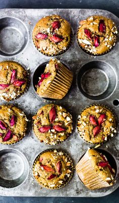 muffins with strawberries and almonds in a muffin tin