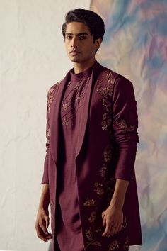 Wine bundi jacket with placement floral hand-embroidery. Paired with embroidered kurta and matching tapered trousers.
Component: 3
Pattern: Embroidered
Type Of Work: Floral
Neckline: Jacket: Open
Sleeve Type: Kurta: Long
Fabric: Linen Silk
Color: Wine
Other Details: 
Embroidered jacket
Floral motifs
Occasion: Sangeet,Wedding - Aza Fashions Designer Chikankari Embroidered Kurta For Fall, Festive Nehru Jacket With Chikankari Embroidery For Fall, Embroidered Designer Wear Sets For Fall, Fall Festive Kurta With Intricate Embroidery, Embroidered Fall Designer Wear Sets, Embroidered Fall Designer Sets, Fall Embroidered Sets, Festive Straight Kurta Outerwear With Floral Embroidery, Festive Kurta With Chikankari Embroidery For Fall