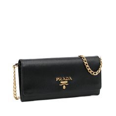 This Prada wallet on chain is made of black textured Vitello Move leather. The Bag features gold-tone details, a gold-tone chain strap, a flap with snap closure, and a zippered compartment and slip pockets for cards inside. The Bag is best across the body or loosely over the shoulder. Prada Wallet On Chain, Prada Wallet, Wallet On Chain, Miuccia Prada, Diaper Backpack, Casual Backpack, Fashion Labels, Leather Goods, Italian Fashion