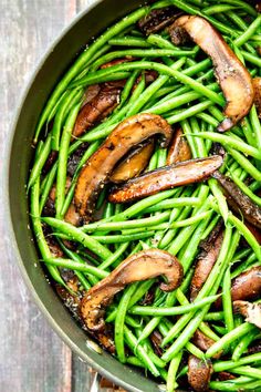 green beans and mushrooms cooking in a pan