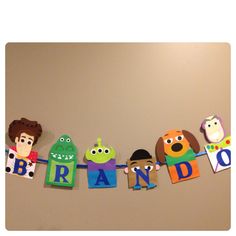 the word brand spelled out with cutouts of people and animals on a clothes line