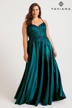 a woman in a long green dress