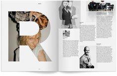 an open magazine with photos of people and letters on the pages, in black and white