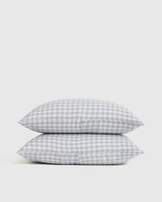 two pillows sitting on top of each other