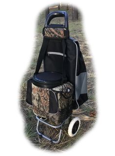 a cooler bag sitting on top of a chair in the grass