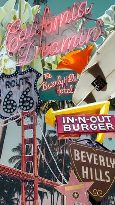 a bunch of signs that are on the side of a building with palm trees in the background