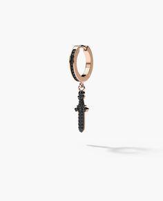 This dangling black diamond dagger earring hangs below a diamond set hoop. The dagger earring has a total carat weight of 0.20 carats and is set with natural black diamonds. Dagger Earring, 10k Engagement Ring, Ship Earrings, Pinky Signet Ring, Black Diamond Bands, Rose Gold Black Diamond, Dagger Earrings, Yellow Gold Wedding Band, Black Diamond Ring